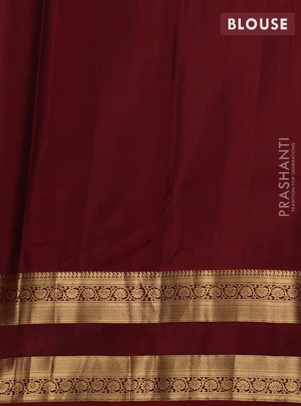 Kanchipuram silk saree wine shade and maroon with allover zari woven buttas and rettapet zari woven border