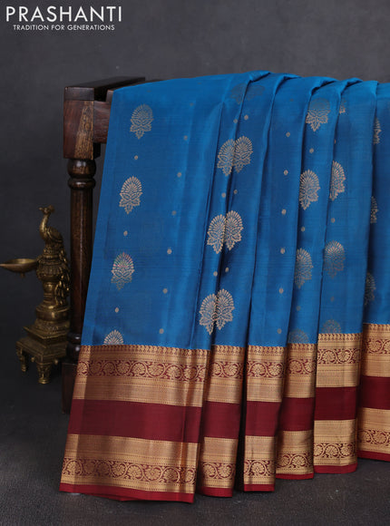 Kanchipuram silk saree peacock blue and maroon with allover zari woven buttas and zari woven border