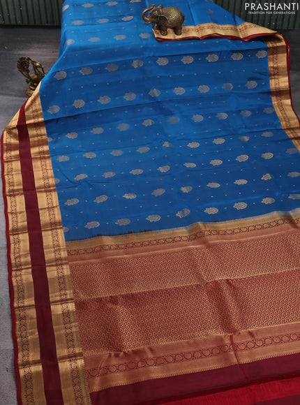 Kanchipuram silk saree peacock blue and maroon with allover zari woven buttas and zari woven border