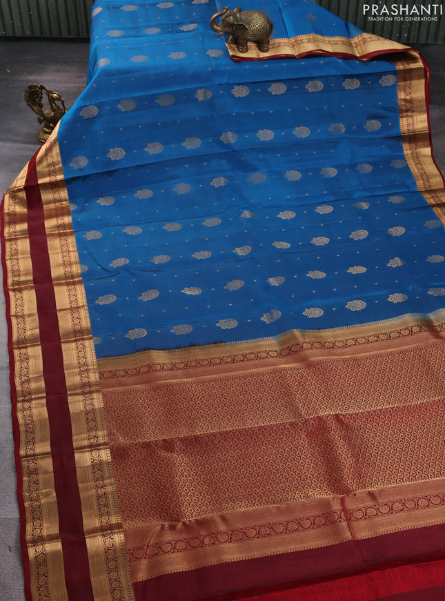 Kanchipuram silk saree peacock blue and maroon with allover zari woven buttas and zari woven border