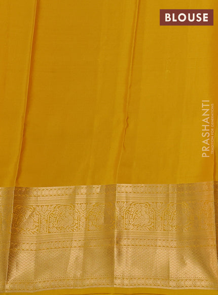 Kanchipuram silk saree yellow with allover zari woven buttas and long zari woven border