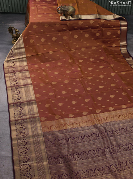 Kanchipuram silk saree dark mustard and coffee brown with allover zari woven buttas and long zari woven border