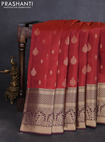 Kanchipuram silk saree rust shade and coffee brown with allover zari woven buttas and long zari woven border