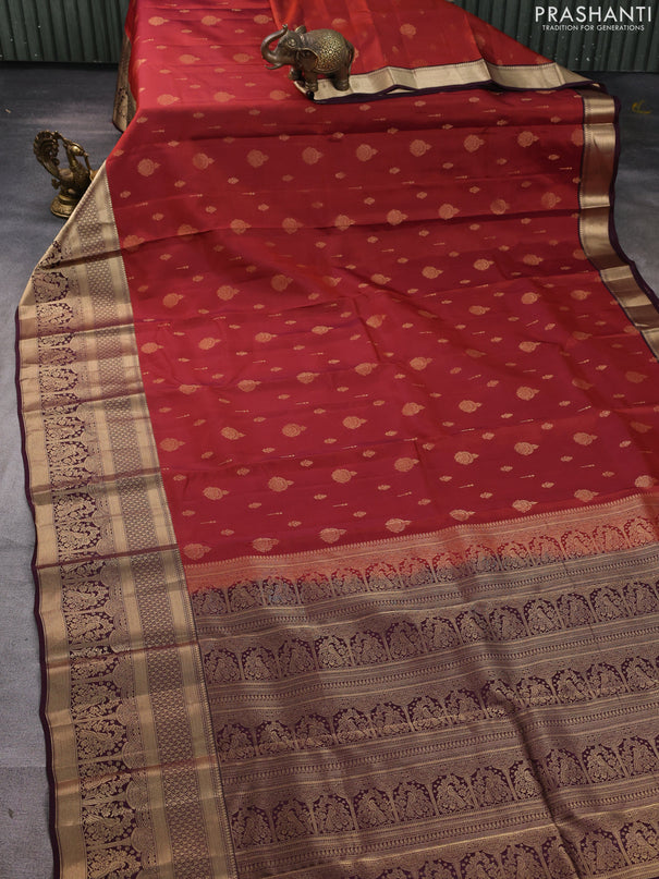 Kanchipuram silk saree rust shade and coffee brown with allover zari woven buttas and long zari woven border