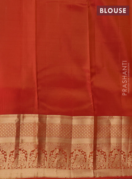 Kanchipuram silk saree yellow and rust shade with allover zari woven buttas and long zari woven border