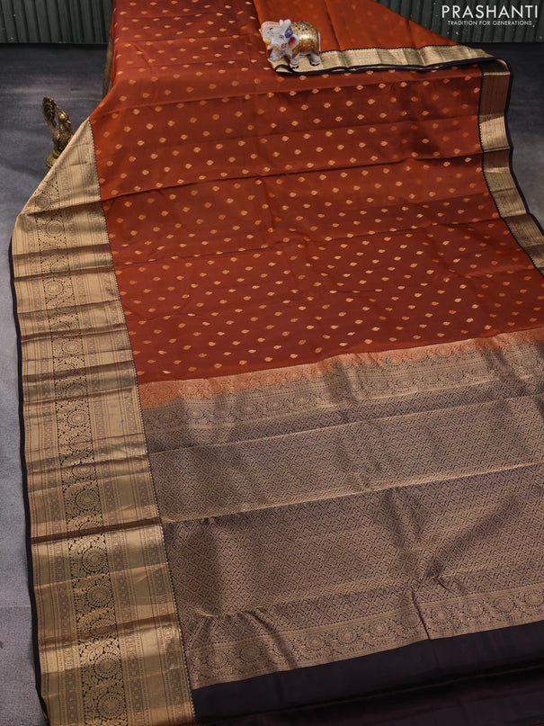 Kanchipuram silk saree rustic orange and coffee brown with allover zari woven buttas and long zari woven border