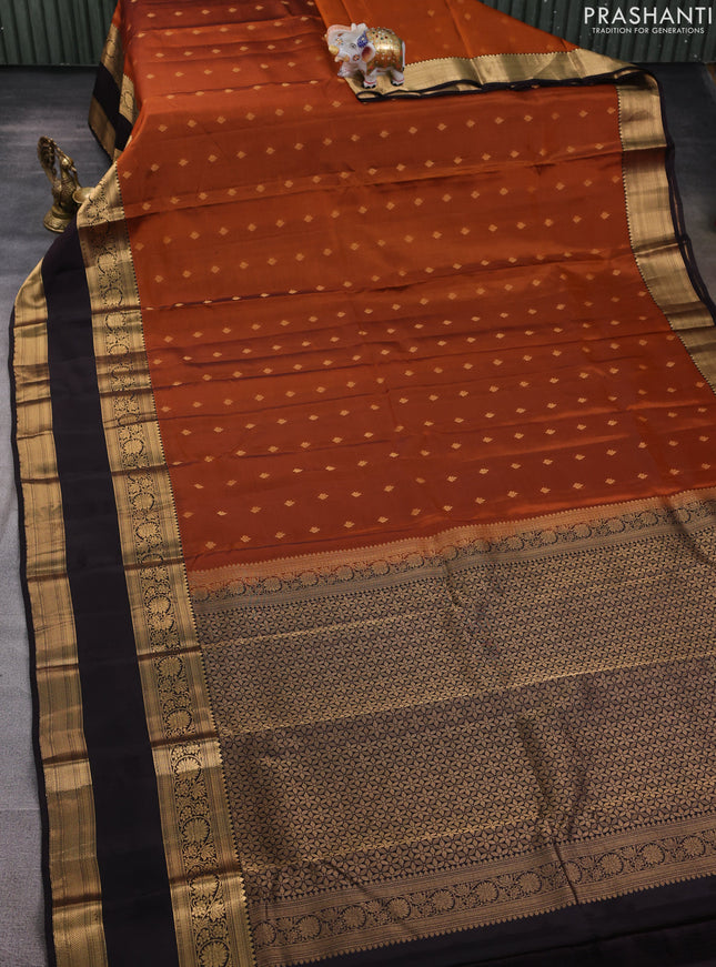 Kanchipuram silk saree rustic orange and black with allover zari woven buttas and long rettapet zari woven border