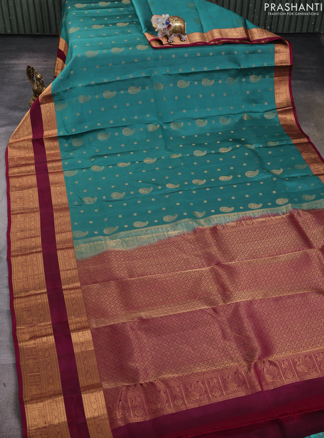Kanchipuram silk saree green shade and wine shade with allover zari woven buttas and long rettapet zari woven border
