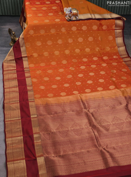 Kanchipuram silk saree sunset orange and deep maroon with allover zari woven buttas and long rettapet zari woven border