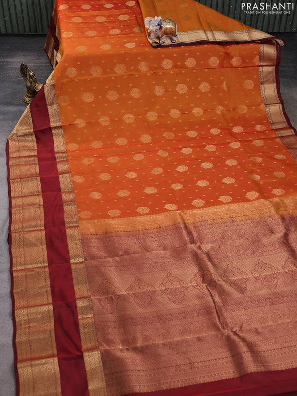 Kanchipuram silk saree sunset orange and deep maroon with allover zari woven buttas and long rettapet zari woven border
