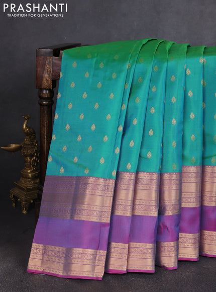 Kanchipuram silk saree teal green and pink with allover zari woven buttas and long rettapet zari woven border