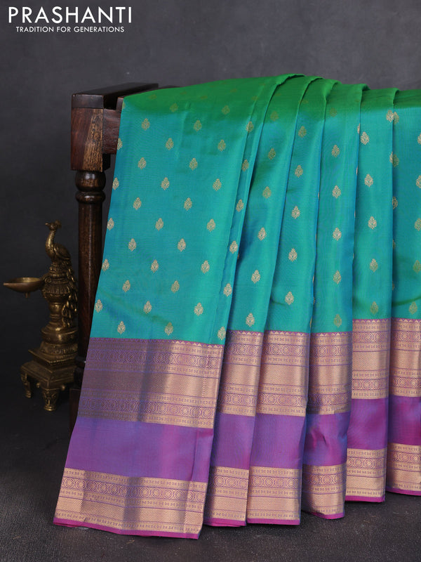 Kanchipuram silk saree teal green and pink with allover zari woven buttas and long rettapet zari woven border