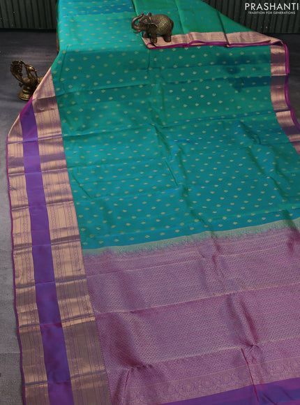 Kanchipuram silk saree teal green and pink with allover zari woven buttas and long rettapet zari woven border
