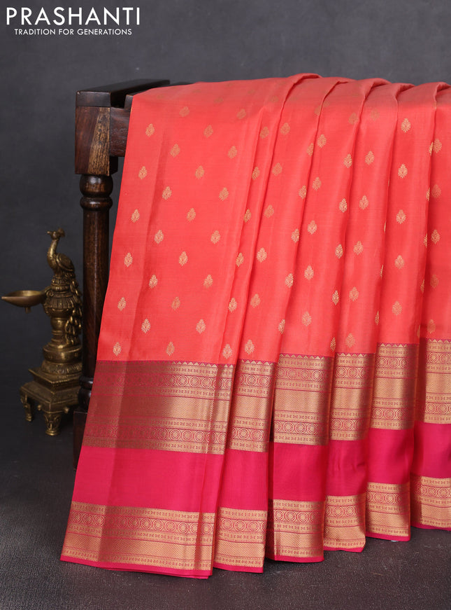 Kanchipuram silk saree orange and pink with allover zari woven buttas and long rettapet zari woven border