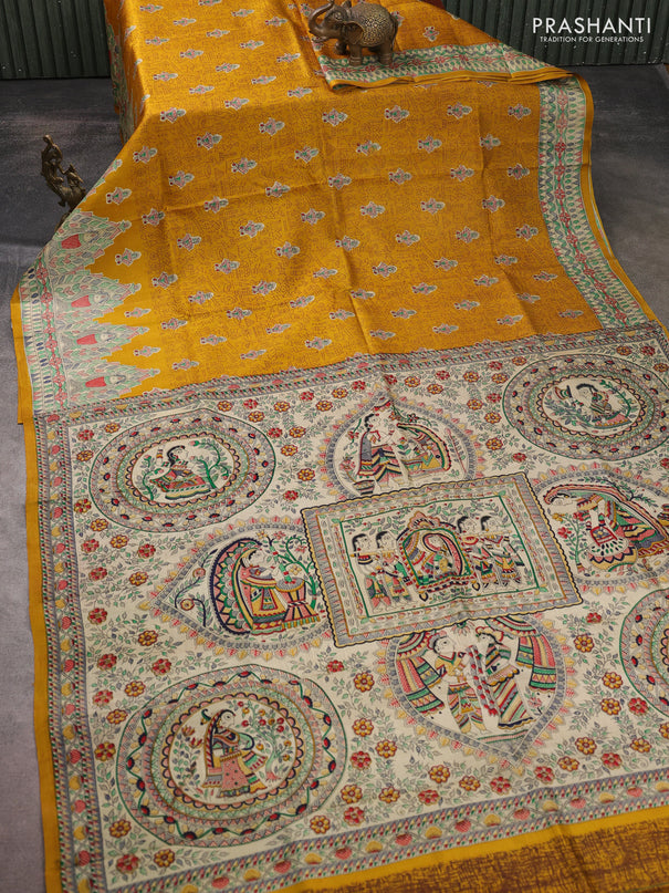 Madhubani printed silk saree mustard yellow and beige with allover warli prints and madhubani printed border