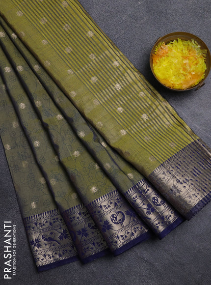 Semi raw silk saree dual shade of mehendi green and navy blue with allover prints & 1000 zari buttas and zari woven border