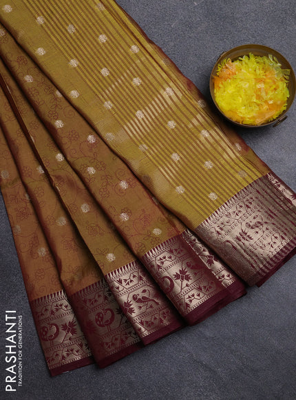 Semi raw silk saree dual shade of dark mustard green and wine shade with allover prints & 1000 zari buttas and zari woven border