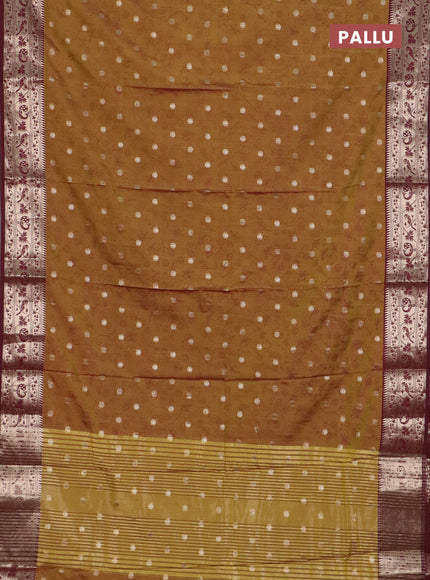 Semi raw silk saree dual shade of dark mustard green and wine shade with allover prints & 1000 zari buttas and zari woven border