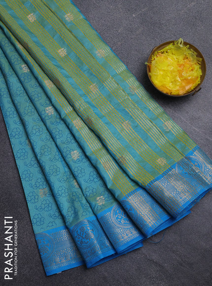 Semi raw silk saree dual shade of teal blue and cs blue with allover butta prints & 1000 zari buttas and zari woven border