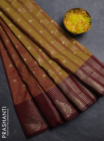 Semi raw silk saree dual shade of dark mustard and wine shade with allover prints & 1000 zari buttas and zari woven border