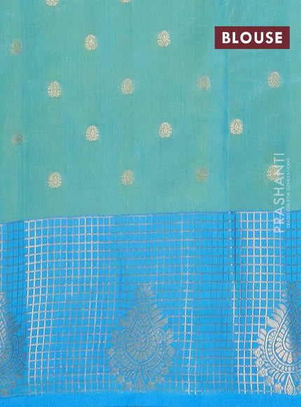 Semi raw silk saree dual shade of light green and cs blue with allover prints & 1000 zari buttas and zari woven border