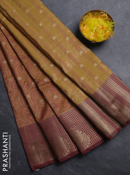 Semi raw silk saree dark mustard and brown with allover prints & 1000 zari buttas and zari woven border