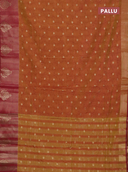 Semi raw silk saree dual shade of dark mustard and maroon with allover kalamkari prints & 1000 zari buttas and zari checked butta border
