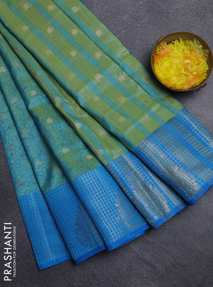 Semi raw silk saree dual shade of teal bluish green and cs blue with allover kalamkari prints & 1000 zari buttas and zari checked butta border