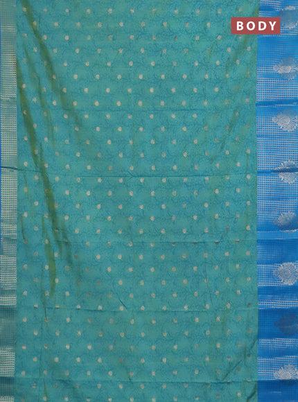 Semi raw silk saree dual shade of teal bluish green and cs blue with allover kalamkari prints & 1000 zari buttas and zari checked butta border