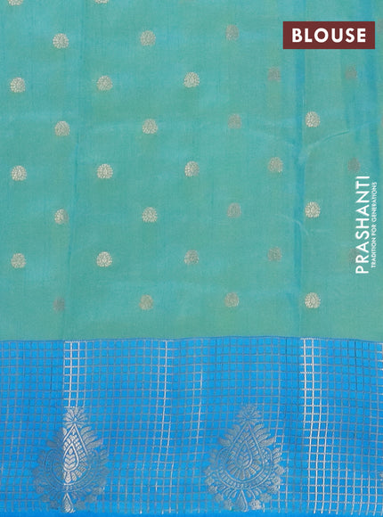 Semi raw silk saree dual shade of teal bluish green and cs blue with allover kalamkari prints & 1000 zari buttas and zari checked butta border