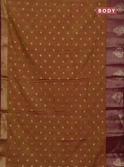 Semi raw silk saree dual shade of dark mustard green and wine shade with allover kalamkari prints & 1000 zari buttas and zari checked butta border