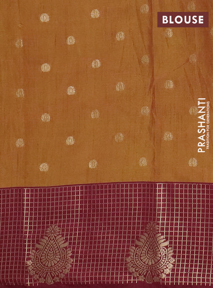 Semi raw silk saree dual shade of dark mustard green and wine shade with allover kalamkari prints & 1000 zari buttas and zari checked butta border