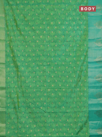 Semi raw silk saree dual shade of light green and teal green with allover kalamkari prints & 1000 zari buttas and zari checked butta border