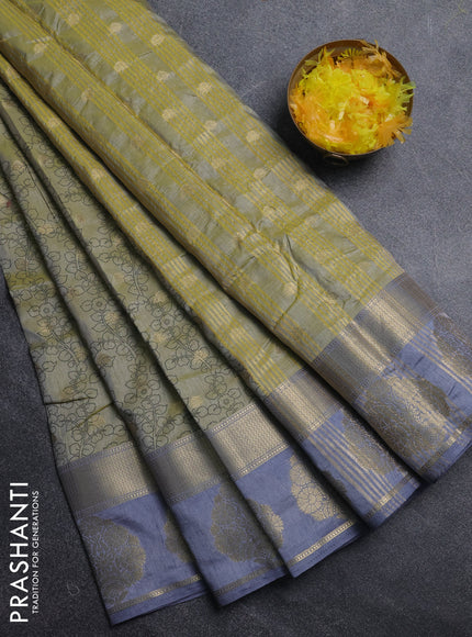 Semi raw silk saree elaichi green and grey with allover kalamkari prints & 1000 zari buttas and zari woven butta border