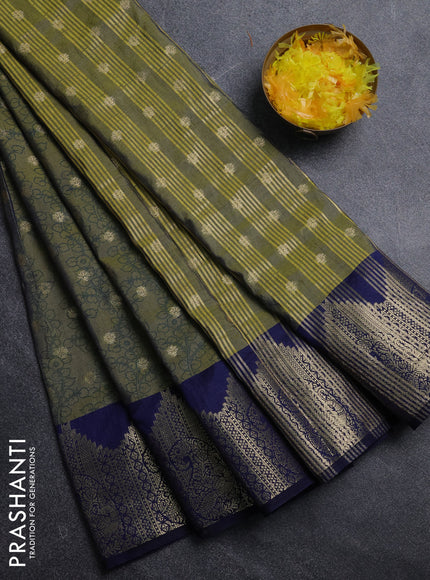 Semi raw silk saree dual shade of green and navy blue with allover kalamkari prints & 1000 zari buttas and temple design zari woven border