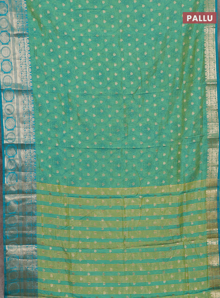 Semi raw silk saree dual shade of teal bluish green with allover prints & 1000 zari buttas and zari woven border