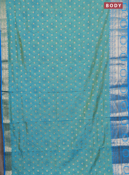 Semi raw silk saree dual shade of teal blue and cs blue with allover prints & 1000 zari buttas and zari woven border