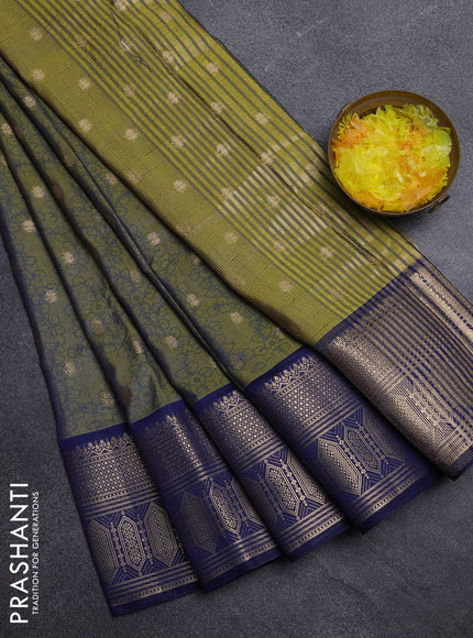 Semi raw silk saree dual shade of mehendi green and navy blue with allover kalamkari prints & 1000 zari buttas and zari woven border