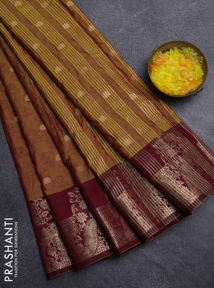 Semi raw silk saree dual shade of dark mustard green and wine shade with allover floral butta prints & 1000 zari buttas and zari woven border