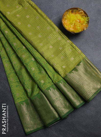 Semi raw silk saree light green and green with allover kalamkari prints & 1000 zari buttas and zari woven border
