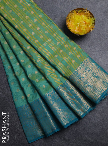 Semi raw silk saree teal bluish green and teal green with allover floral butta prints & 1000 zari buttas and zari woven border