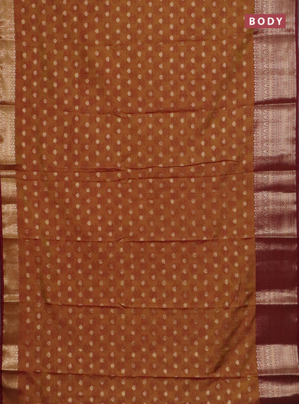 Semi raw silk saree dark mustard and maroon with allover floral butta prints & 1000 zari buttas and zari woven border