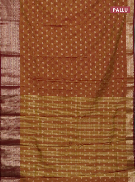 Semi raw silk saree dark mustard and maroon with allover floral butta prints & 1000 zari buttas and zari woven border