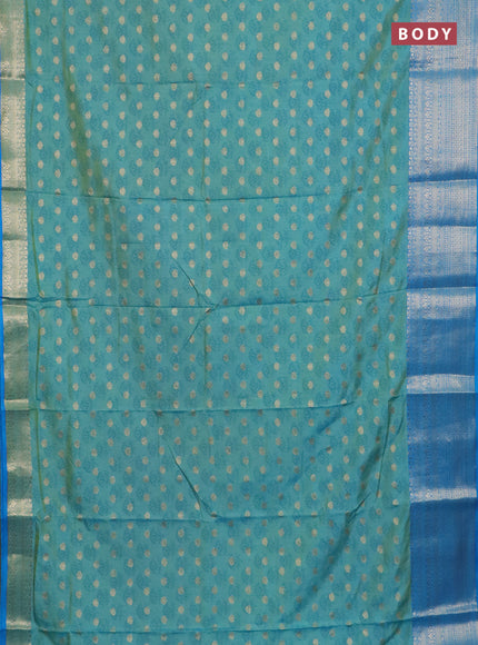 Semi raw silk saree dual shade ot teal blue and cs blue with allover floral butta prints & 1000 zari buttas and zari woven border