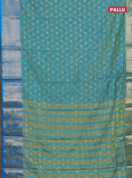 Semi raw silk saree dual shade ot teal blue and cs blue with allover floral butta prints & 1000 zari buttas and zari woven border