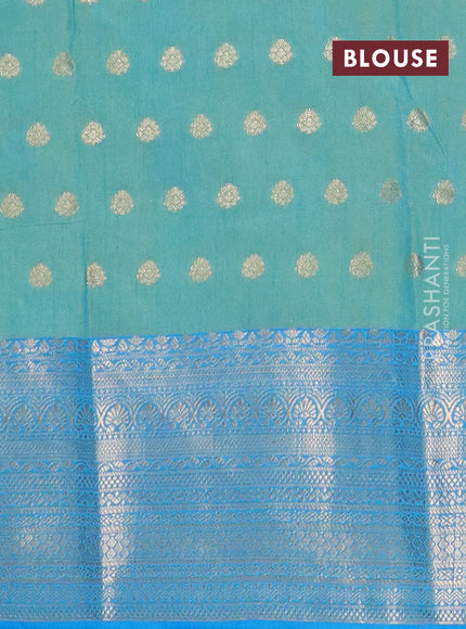 Semi raw silk saree dual shade ot teal blue and cs blue with allover floral butta prints & 1000 zari buttas and zari woven border
