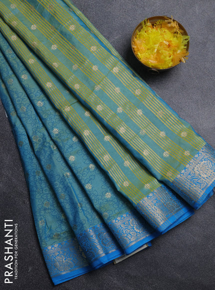 Semi raw silk saree dual shade of teal blue and cs blue with allover kalamkari prints & 1000 zari buttas and zari woven border