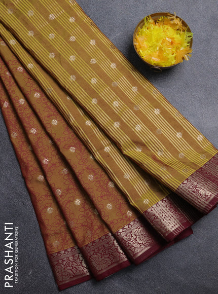 Semi raw silk saree mehendi green and wine shade with allover kalamkari prints & 1000 zari buttas and zari woven border