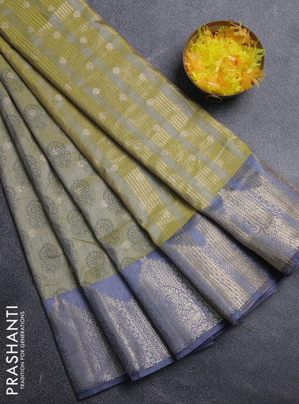 Semi raw silk saree elaichi green and grey with allover floral butta prints & 1000 zari buttas and temple design zari woven border