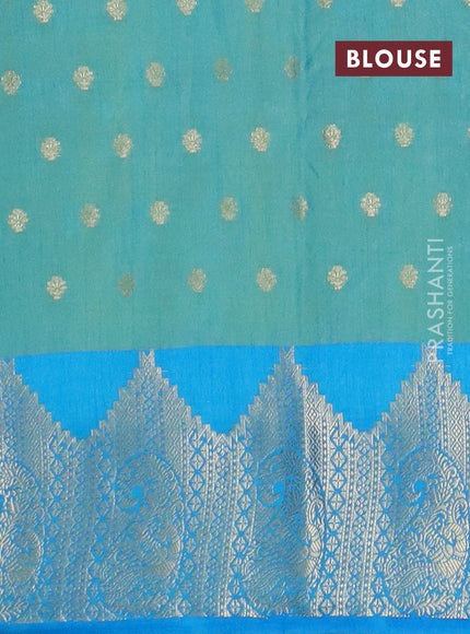 Semi raw silk saree dual shade of teal bluish green and cs blue with allover floral butta prints & 1000 zari buttas and temple design zari woven border